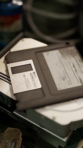 old computer floppy disk and motherboard