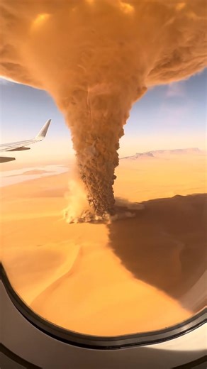 Flying over a sand hurricane — a swirling wall of dust twisting through the desert below. The whole sky turned gold from the sunlight hitting it. #earthimpacts #sandstorm #desert #aivideo #aiart #storm #realistic #madewithai #skyview #nature | Earth Impacts