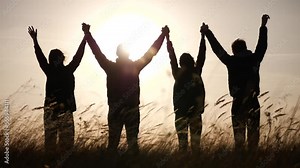 teamwork. team community hold hands together silhouette at sunset unity. group of people hands. teamwork a workers carry business out put your hands up. team in the company working partnership