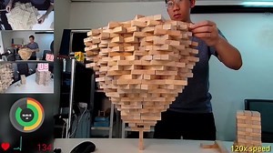 Man Stacks an Amazing 1,512 Jenga Blocks Onto One Vertical Jenga Block Breaking His Own World Record