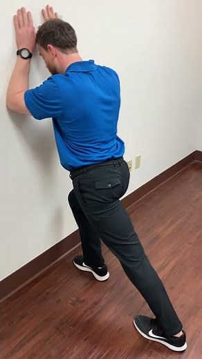 Gastrocnemius wall stretch (calf stretch)