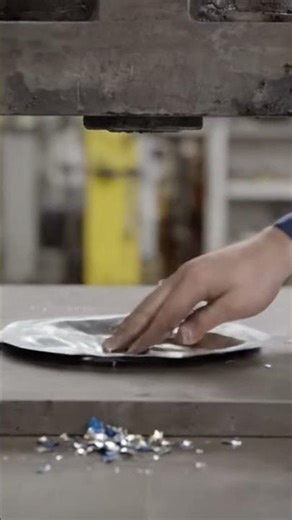 Coca cola can under hydraulic press machine