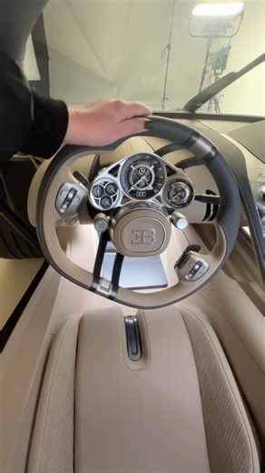 407K views · 2.9K reactions | The Bugatti Tourbillon's name isn't its only watch-inspired element. The gauge cluster is presented like a mechanical timepiece, and it mounts to the steering column and is never obscured. | Car and Driver | Facebook