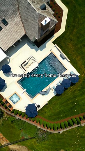 5.1K views · 88 reactions | This backyard design gives a full outdoor living experience. The pool and spa are surrounded by shaded seating, a cooking area, and clean landscaping that ties everything together. It’s a complete setup that makes the home feel finished inside and out. #backyarddesign #outdoorliving #outdoorlivingspace #landscaper #landscapingdesign #backyardlandscaping #landscapedesign #landscape #swimmingpool | P.J.E. Lawn Care & Landscaping | Facebook