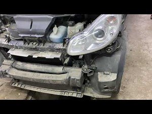 Where is the horn located in the Smart ForTwo?