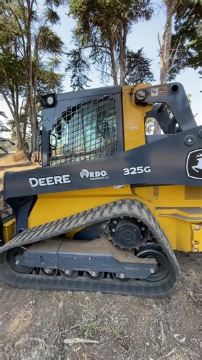 Clearing the way with muscle and precision 💪🌲—this track loader makes light work of heavy timber, hauling cut-up trees with pallet forks like a pro. | RDO Equipment Co.