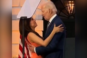 Awkward hug: Eva Longoria takes president Biden hands of her