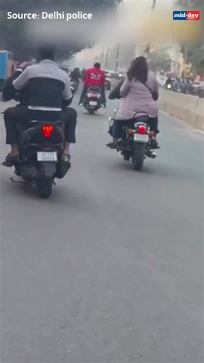 Delhi Police flagged a dangerous scooty stunt by sharing a video of two men riding recklessly, reminding the public that such actions put lives at risk. Urging commuters to prioritise safety over thrill, the police reiterated the importance of strictly following traffic rules. Source: Delhi Police | MiD DAY