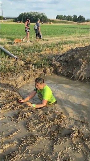 Obstacle Course Runner Takes Mud Plunge, Laughs