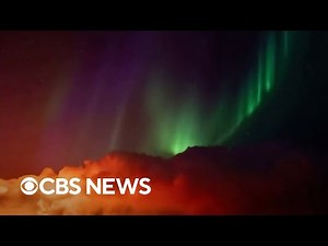 Video shows northern lights shining over erupting Iceland volcano