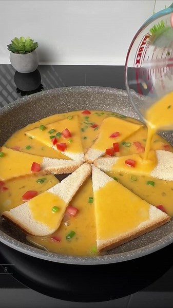 #VNVideoEditor CRISPY EGG & TOAST BREAKFAST WITH CHEESE. DON'T MISS OUT ON THIS CRISPY EGG & TOAST BREAKFAST RECIPE! INGREDIENTS: ● Toast bread — 2 slices ● Eggs — 4 Pcs. ● Tomato — ¼ Pc. ● Green onion — 10 g ● Cheddar cheese — 2 slices ● Cucumber — 6 slices ● Lettuce — a few leaves ● Ketchup — 1 tbsp. ● Butter — 1–2 tbsp. ● Salt — to taste INSTRUCTIONS: 1.Lightly grease a skillet with butter. 2.Cut each slice of toast bread into 3 pieces, making 6 pieces in total. 3.Arrange the bread pieces in 
