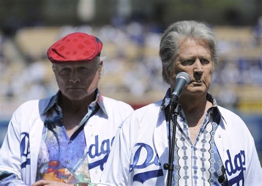 How did Brian Wilson and Mike Love begin their feud?
