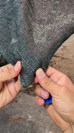 Secure the corners of the tarp with plastic bottles