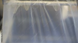 Raw materials for the production of bags in the manufacturing process. The process of manufacturing a plastic bag. 1920X1080 Full Hd.