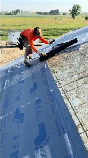 Installing underlayment #roofing #viral #roofinglife