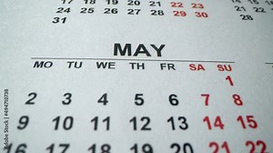 Video „May 2022. Calendar. Save the date. Macro detailed calendar with holidays, weekend and working days. Second world war win date. Many holidays. Spring month. Map 9th. Rotating calendar. Close up shot.“ ze služby Stock