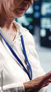 Vertical video Precise professional working in server farm housing GPU dedicated supercomputers that can process AI tasks with high efficiency, reconditioning inoperational rigs used for machine