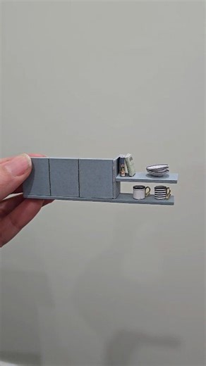 This tiny kitchen cabinet is handmade… and it’s SO cute! 🥹✨ In today’s mini DIY, I’m creating a dollhouse kitchen cabinet using simple materials and lots of patience 💛 Perfect for: ✨ Dollhouse kitchens ✨ Mini home decor lovers ✨ Handmade miniature collectors ✨ DIY craft fans I love building tiny furniture that makes a dollhouse feel real 🏠✨ Small details create BIG magic! Would you add this cabinet to your mini kitchen? 😍 👉 Follow @minimusecrafty for more dollhouse furniture, miniature acce