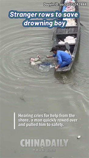 Stranger rows to save drowning boy