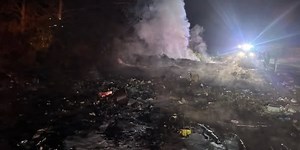 Greene County officials investigating after large woods and debris fire