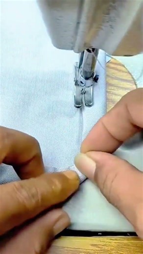 Sewing fabric edges neatly using a sewing machine to create a straight clean seam along fabric edges