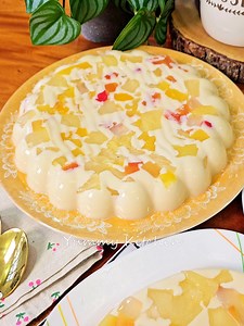 Fruity Jelly Dessert is a vibrant and refreshing sweet treat made with colorful gelatin, fresh or canned fruits, and a creamy or syrupy base. Perfect for any occasion, this dessert is easy to prepare and loved by both kids and adults. Whether served in individual cups or a large bowl, its bright colors and fruity flavors make it a crowd-pleasing centerpiece for parties or casual gatherings. Chill it before serving for a cool and delightful dessert experience! #FruityJellyDessert #EasyDesserts #C