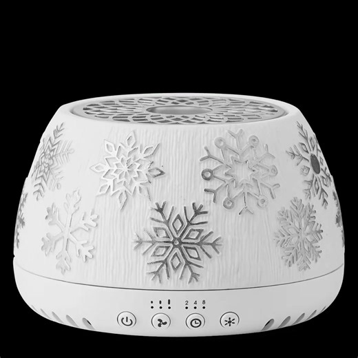 Scentsy Air Quad Silver – Snowflake £173.00 Let it snow! Ideal for larger spaces, the powerful Scentsy Air Quad has incredible reach. This fan-powered diffuser can scent areas anywhere from 200 to 1,000 square feet (23 to 93 square metres), using up to four Scentsy Pods for customisable fragrance strength. Plus, it’s designed with a ceramic shade for your winter décor. Three fan settings: Low, Standard and High. Run continuously or set a timer for two, four or eight hours. 14 light modes, includ