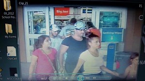 Attempt to Identify (17-029233) On 7-30-2017 the unknown suspects entered the open Sam’s Club store between the hours of 1124 hours and left at approximately 1141 hours. While in the store the suspects worked together to as a group to distract an employee who was working the electronic department. While one suspect was distracting the employee another male suspect forcibly entered into a cabinet which contained multiple cell phones. Then another female suspect walked over bent down and placed mu
