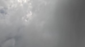 Timelapse fluffy Cumulus clouds moving in bright sunset sky. Abstract aerial nature summer ocean sunset, sea and sky view. Vacation, travel, holiday concept. Weather and Climate Change