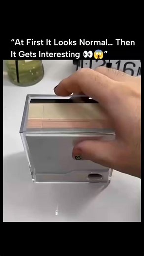 GLOBAL Explained on Instagram: "This 25-second clip shows a 2026 desk calendar doing something completely unexpected. Instead of just counting days, each weekly sheet peels away to slowly reveal a detailed 3D papercraft scene of Santorini—whitewashed buildings, blue domes, and the Aegean coastline emerging layer by layer over the course of the year. The design blends timekeeping with sculptural art, drawing inspiration from traditional Japanese kirigami. Rather than instant impact, it rewards pa