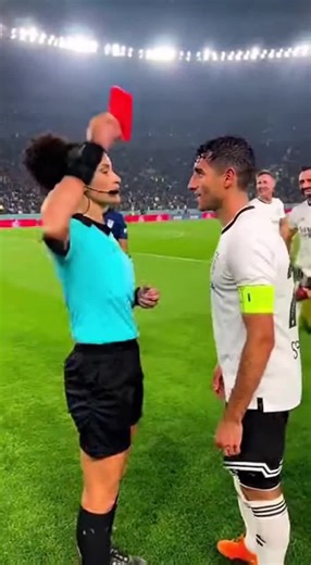 When arguing doesn’t work, try charm 😆⚽ #FootballHumor #RedCardScene #CrazyMatch #ViralSports #LiveFootball