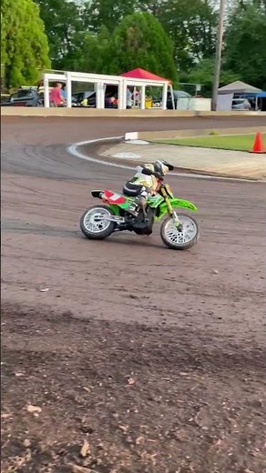 Losi Promoto MX RC dirt bike making practice laps on the dirt oval