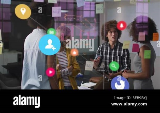 Team brainstorming in room, man tapping tablet generating social media icons on glass sticky notes. Collaboration, ideation, office, workspace, creative, modern, colorful Stock Video Footage - Alamy