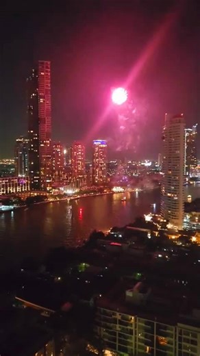 Spectacular night fireworks over city skyline | Mesmerizing river reflections & city lights