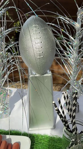 Let’s make a Lombardi Trophy centerpiece out of one of my sons many footballs laying around the house and a glass vase that has been on my kitchen counter for years 😂 this was sooo easy and fun to create!!! What you’ll need: - football - tall glass vase -metallic silver spray paint - hot glue Optional: little piece of chopstick piece to lean the football against (I highly suggest spray painting it after the football is on the vase 😂) Let me know if you try it! #diy #diyprojects #diyprojectside
