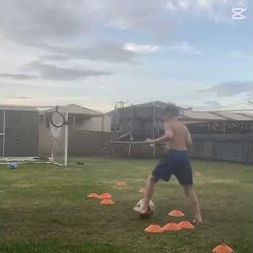 Practicing soccer in the backyard