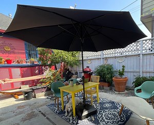 Affordable, easy to roll around, very heavy umbrella stand