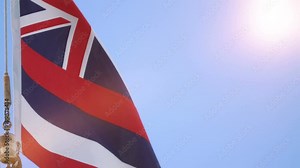 Professional video of hawaiian flag waving in the wind in 4k slow motion 60fps