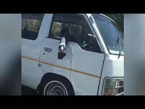 WATCH | Taxi driver cruises highway with leg dangling out of window