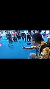 14K views · 142 reactions | Bermain-main dengan anjing (robot) di #CAEXPO2025. Lucu dan pintar! | Tahu Tahu | Facebook