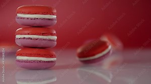 A macaroon is spinning on a surface near a stack of macaroons