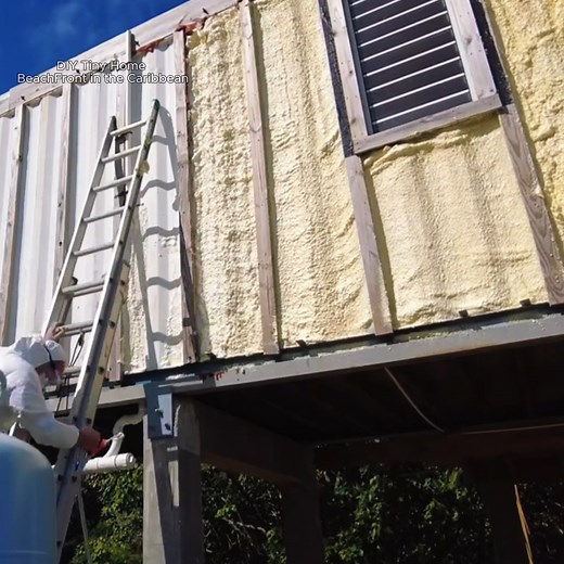 Watch him add crucial spray foam insulation to his shipping container tiny home! This step is essential for keeping cool in the Caribbean sun and making his beachfront dream a reality. See how he tackles this DIY project to create a comfortable and energy-efficient living space. | Shipping Container World