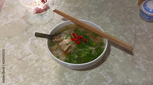 A bowl of pho noodle soup. Traditional Vietnamese rice noodles pho with fresh beef soup. Fresh pho soup. Vietnamese pho soup.