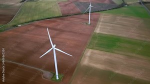 Alignment of wind turbines on a line, drone shot over the installations Stock Video