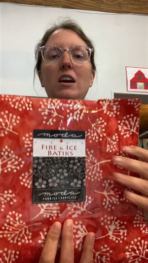 We love this Fire and Ice Batik from Moda. The red, gray, and black combination is so fun! #fricebatikcake #modabatik #fdquilts #FabricFriday | Farmer's Daughters Quilts