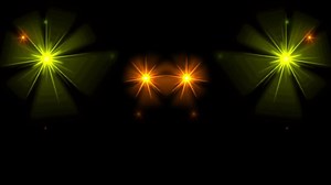 Animation orang light sparkles on black background.