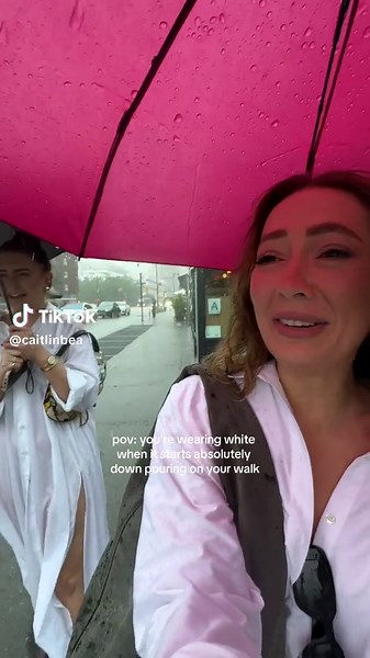 Girl in White Shirt Embraces Rainy Day in NYC