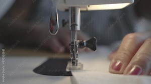 Precise perfect sewing machine stitches in tandem closeup