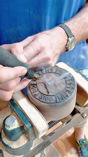 burning intricate runes and designs onto a wooden cup using a professional pyrography wood pen