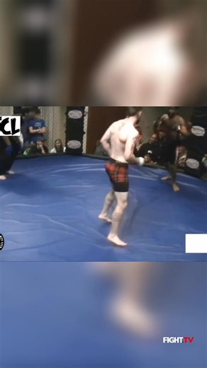 Experience the raw energy as two fighters go head-to-head in the octagon, exchanging powerful blows. The crowd watches in anticipation as the referee closely monitors the intense MMA fight. #MMA #FightNight #Octagon #Fighters #CombatSports #IntenseBattle | FIGHT.TV